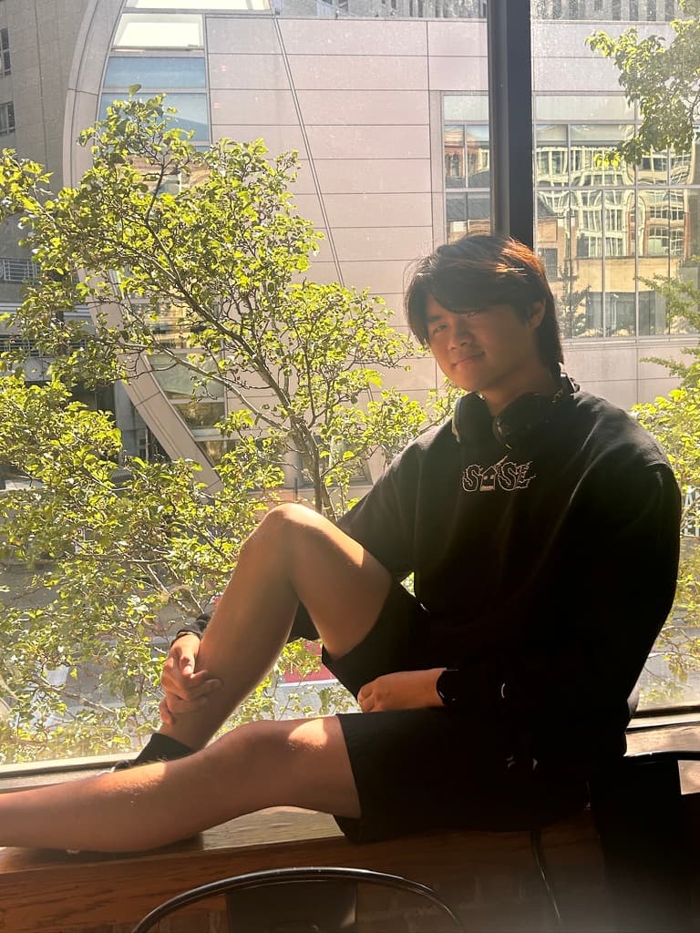 Kenzo by a window at golden hour